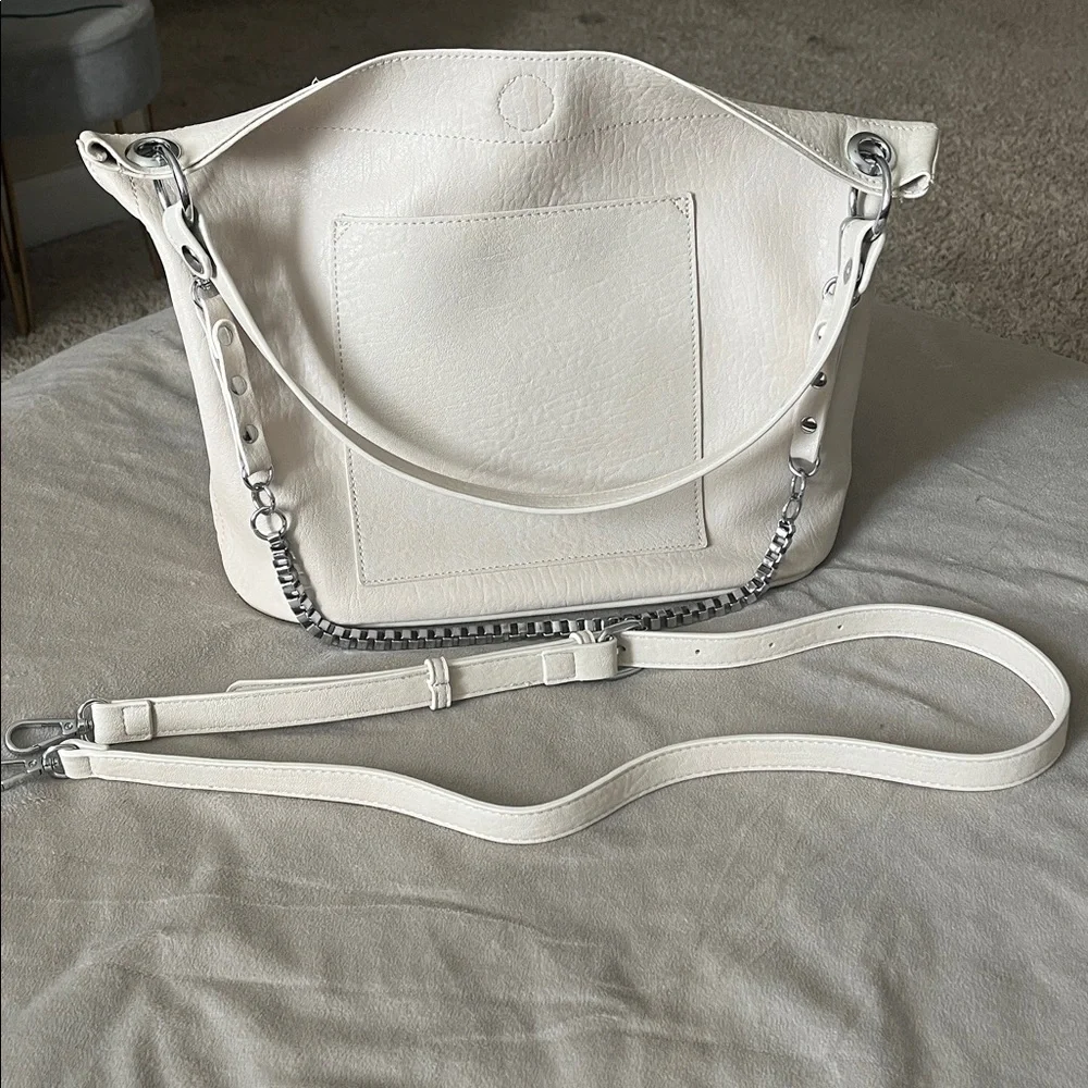 Madison West Purse in a purse
Cream purse w/ silver details. - Picture 4 of 6